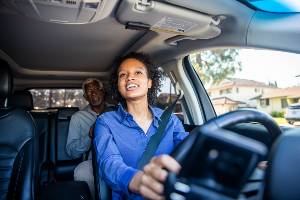 woman driving for uber with passenger