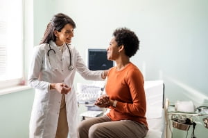 Caring doctor listens to patient