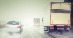 photo illustration of cars on rainy road