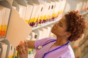 nurse looking at medical records