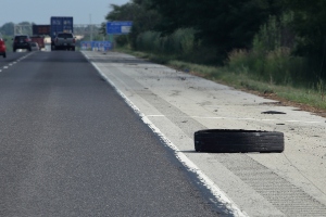 Tires on the side of the road.