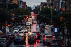 Cars at a red light intersection.